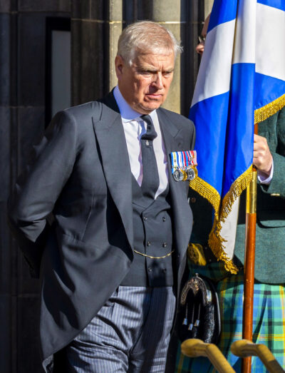 Andrew walking outside looking down