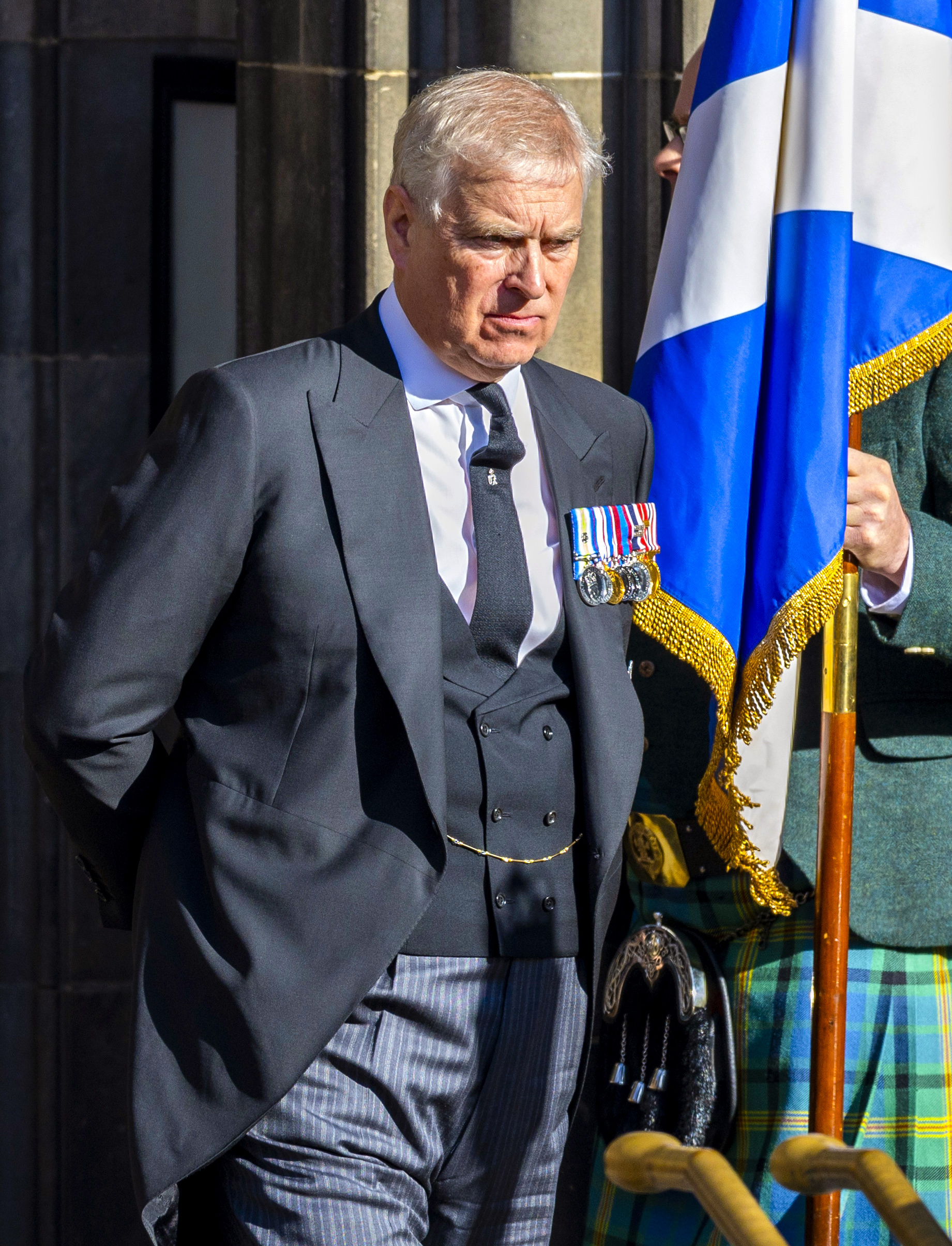 Andrew walking outside looking down 