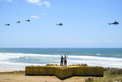Ant and Dec waving from the beach