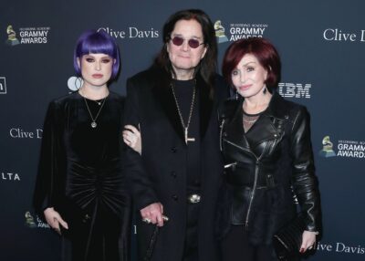 Sharon and Kelly Osbourne with Ozzy at an event