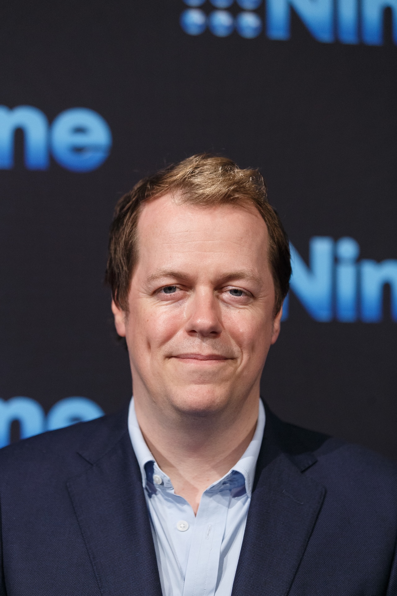 Tom Parker-Bowles at an event smiling at camera