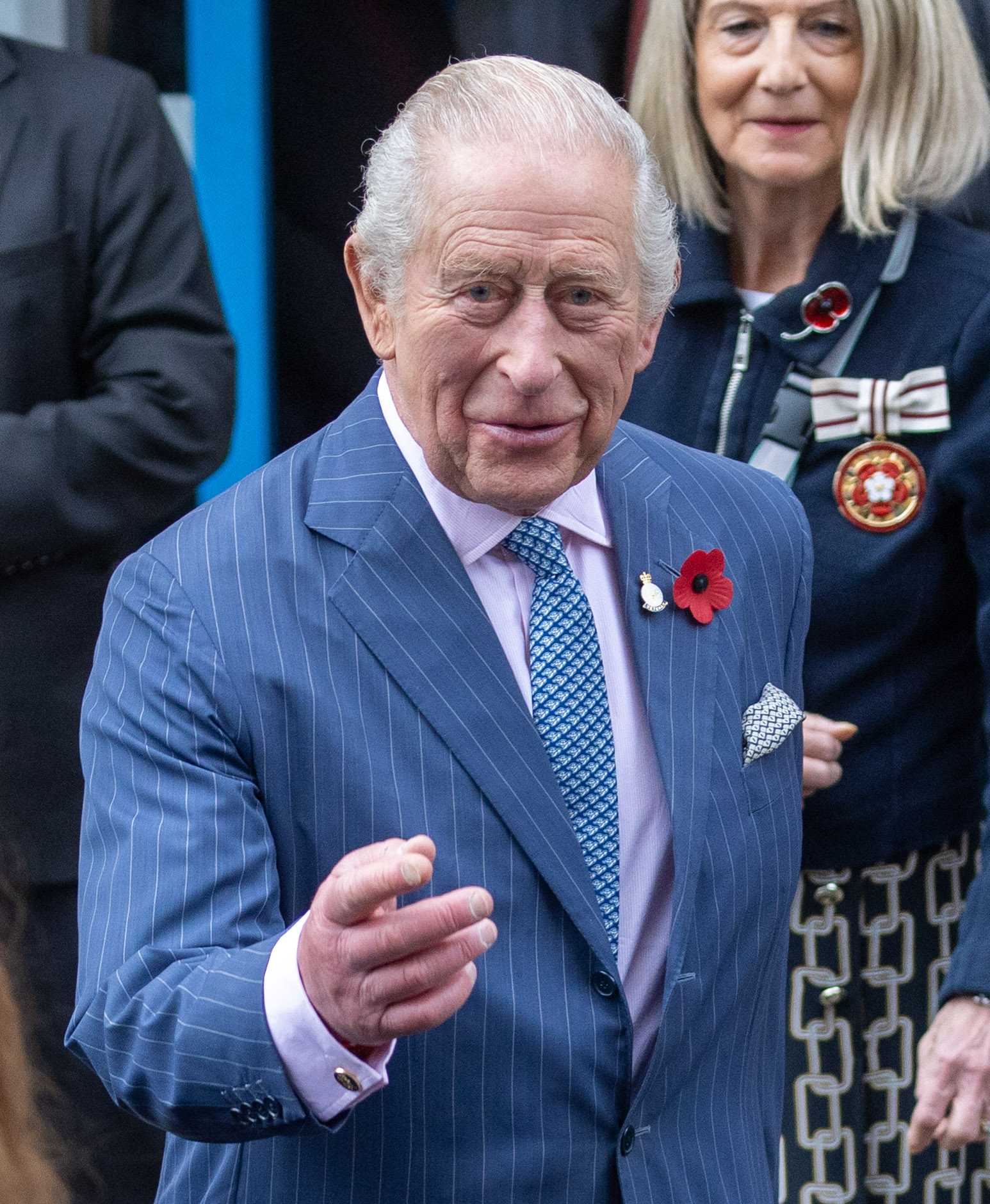 King Charles standing in blue suit