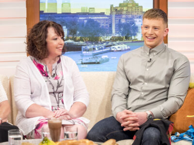 Caroline and Adam Peaty smiling on GMB