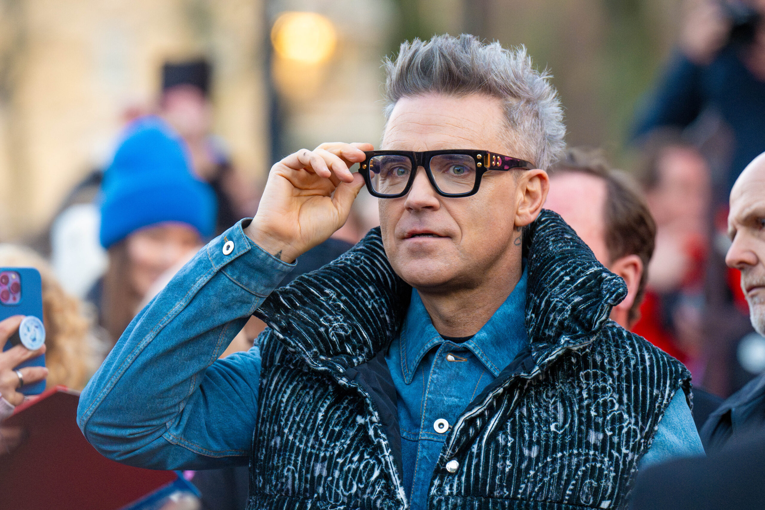 Robbie Williams wearing glasses