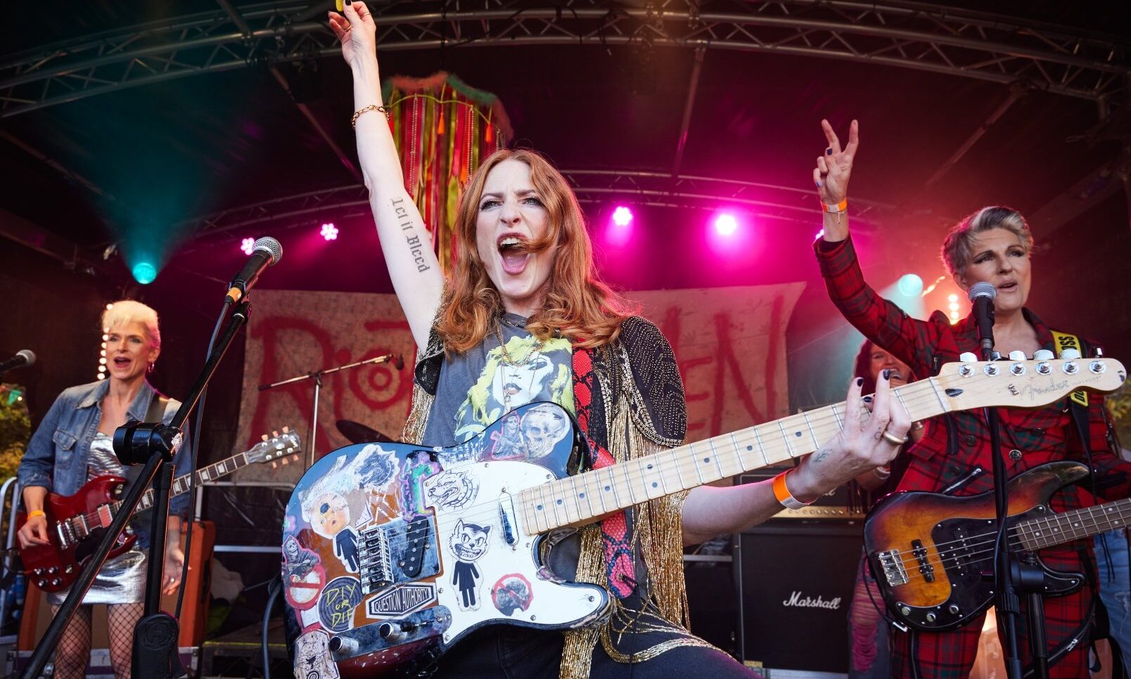 Rosalie Craig leads the Riot Women band performance