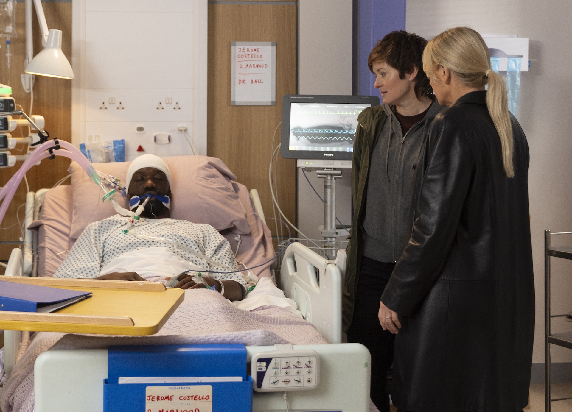 Becky and Lisa at Costello's hospital bedside