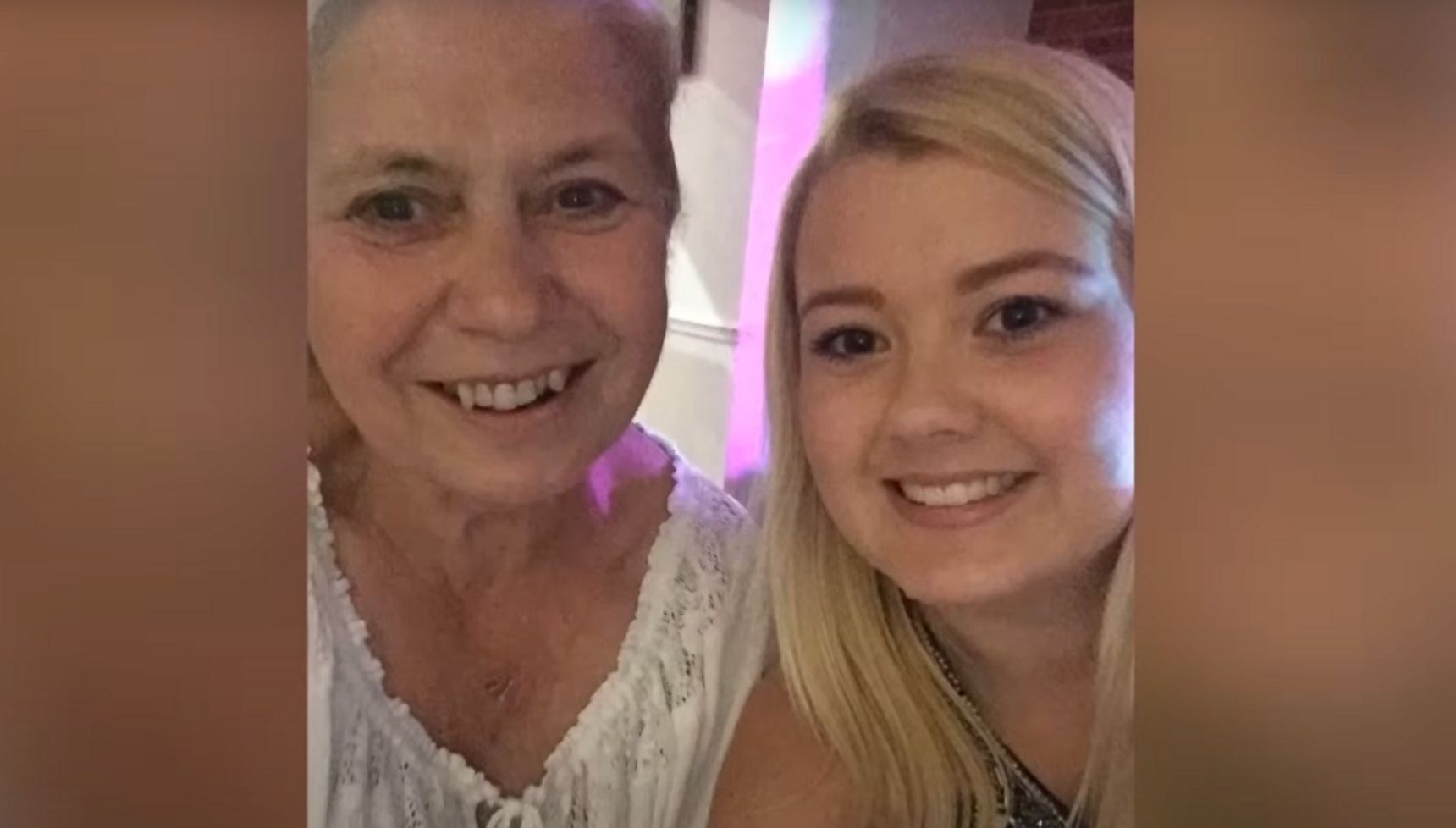 Helen Holland smiling beside her granddaughter 