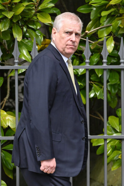 Andrew Mountbatten-Windsor walking in suit