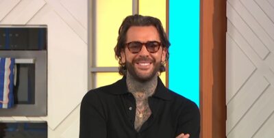 Pete Wicks folding his arms in the Lorraine studio