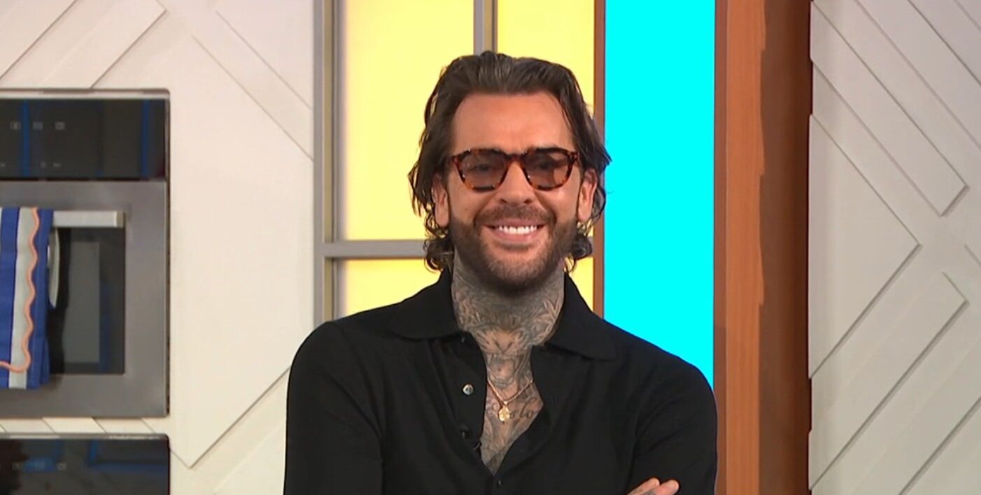 Pete Wicks folding his arms in the Lorraine studio