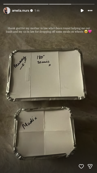 Two takeaway containers with writing on the lids