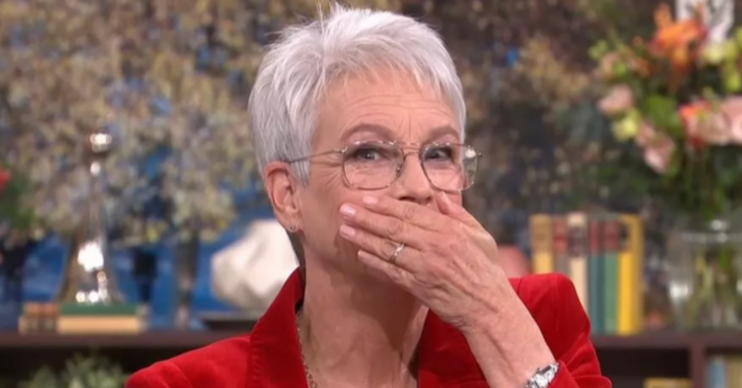 Jamie Lee Curtis with her hand over her mouth