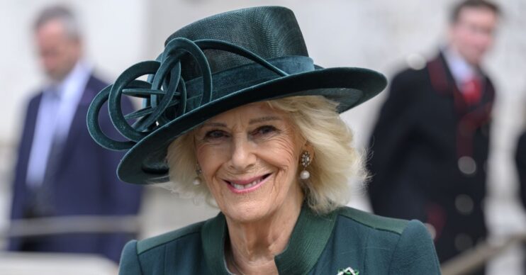 Queen Camilla wearing a green hat