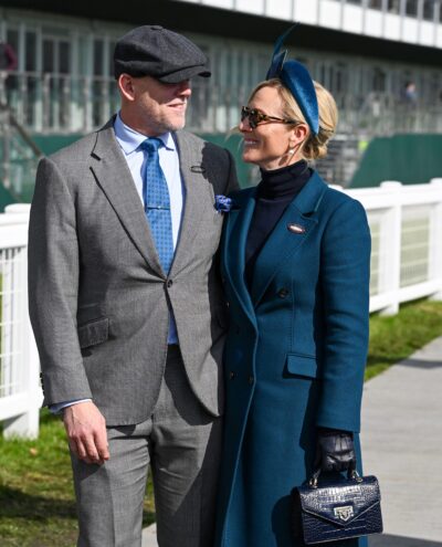 Mike and Zara Tindall smiling at each other at Cheltenham Festival