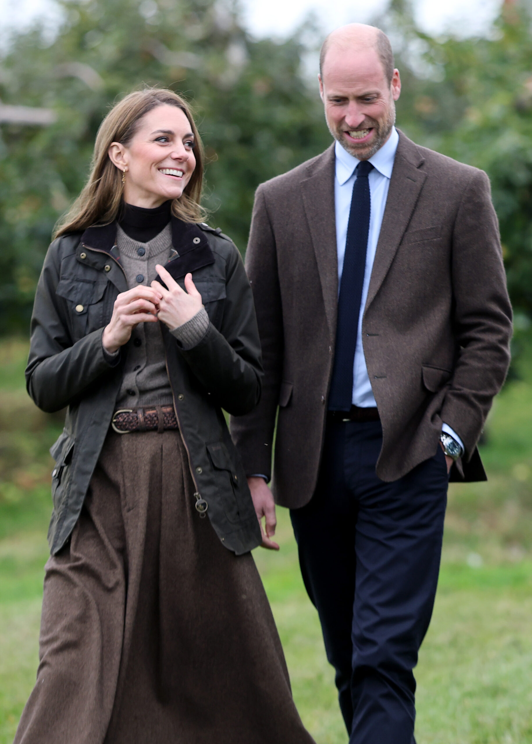 Prince William and Kate Middleton walking and smiling