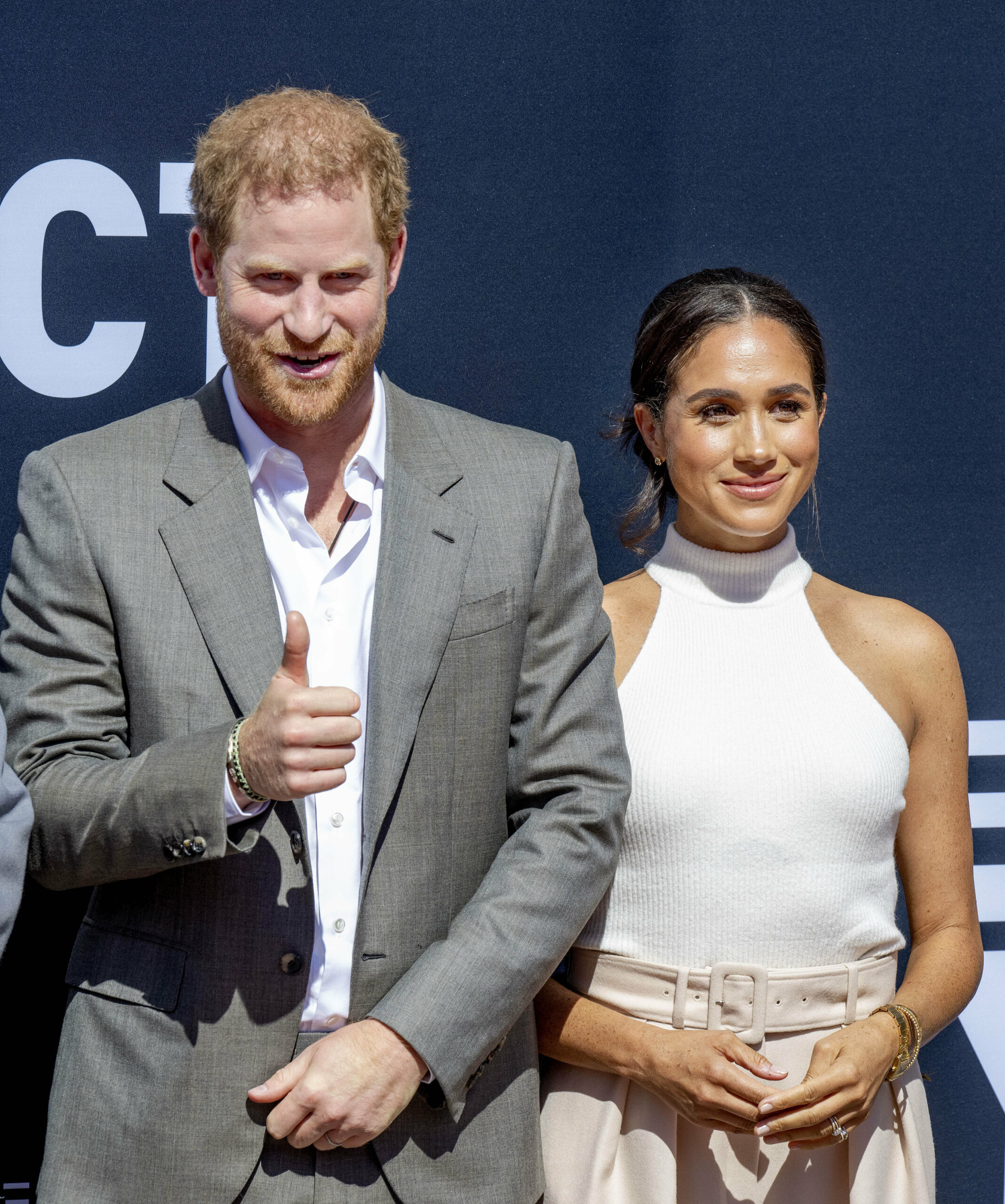 Prince Harry and Meghan Markle smiling side by side
