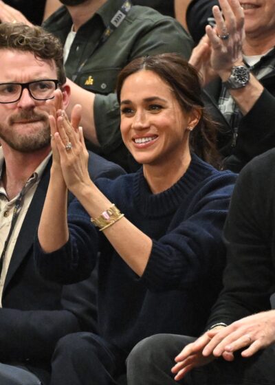 Meghan Markle clapping at event