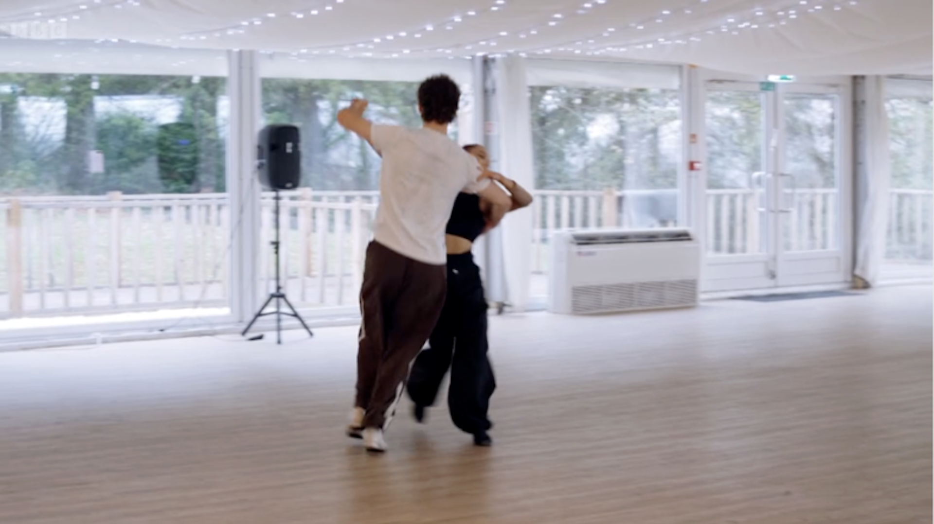 George and Alexis dancing together
