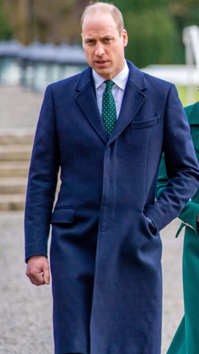 Prince William walking in long coat