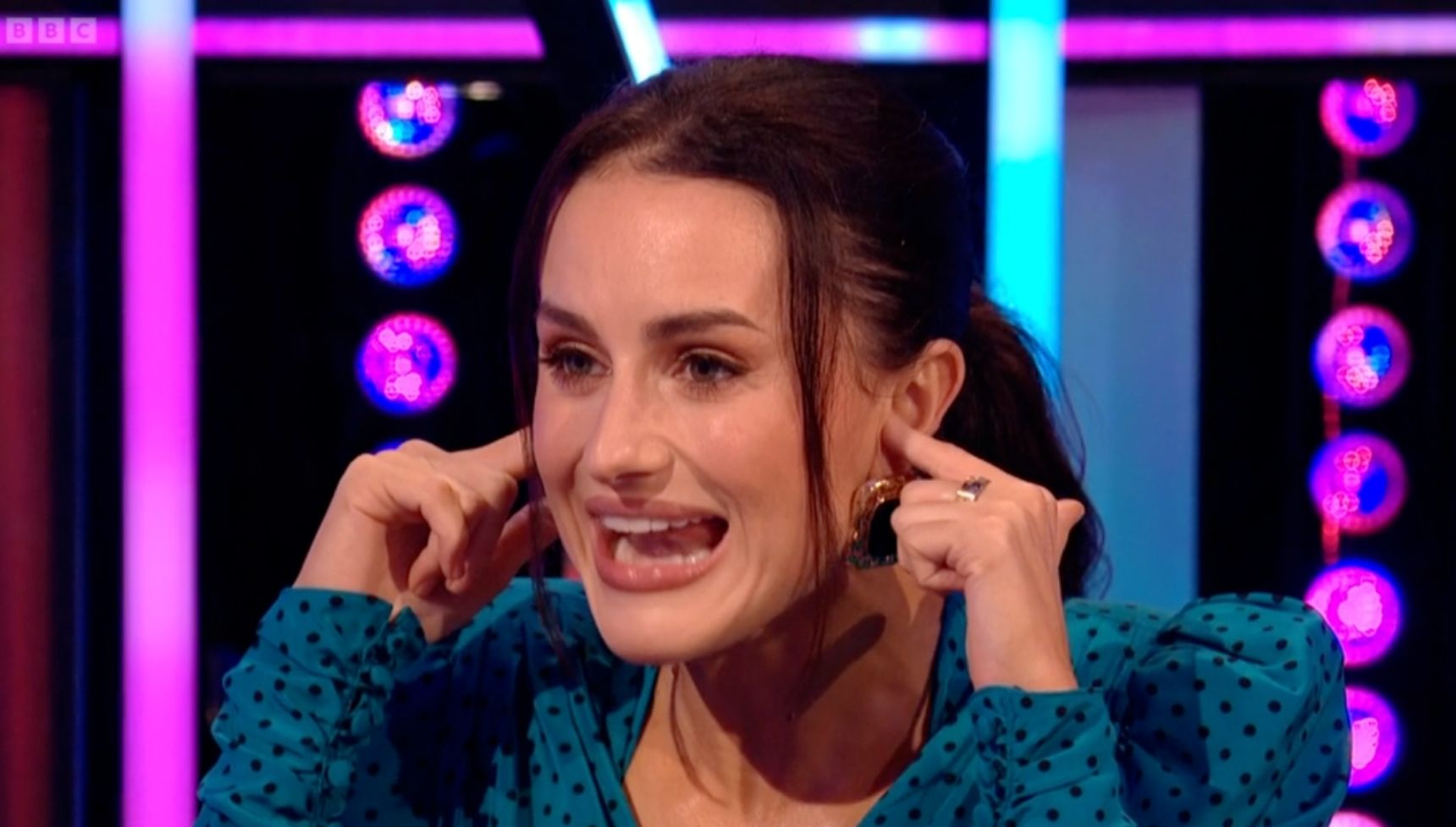 Amber Davies holding her ears on It Takes Two