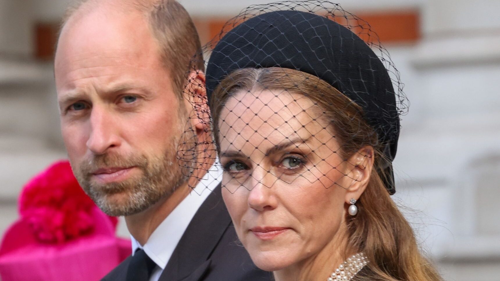 Prince William frowning beside Princess Kate