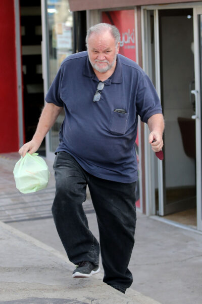 Meghan Markle's father Thomas walking out of shop
