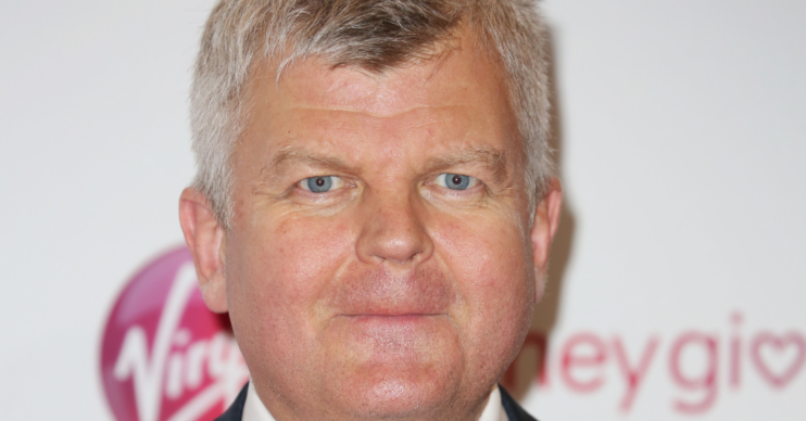 Adrian Chiles looking to camera