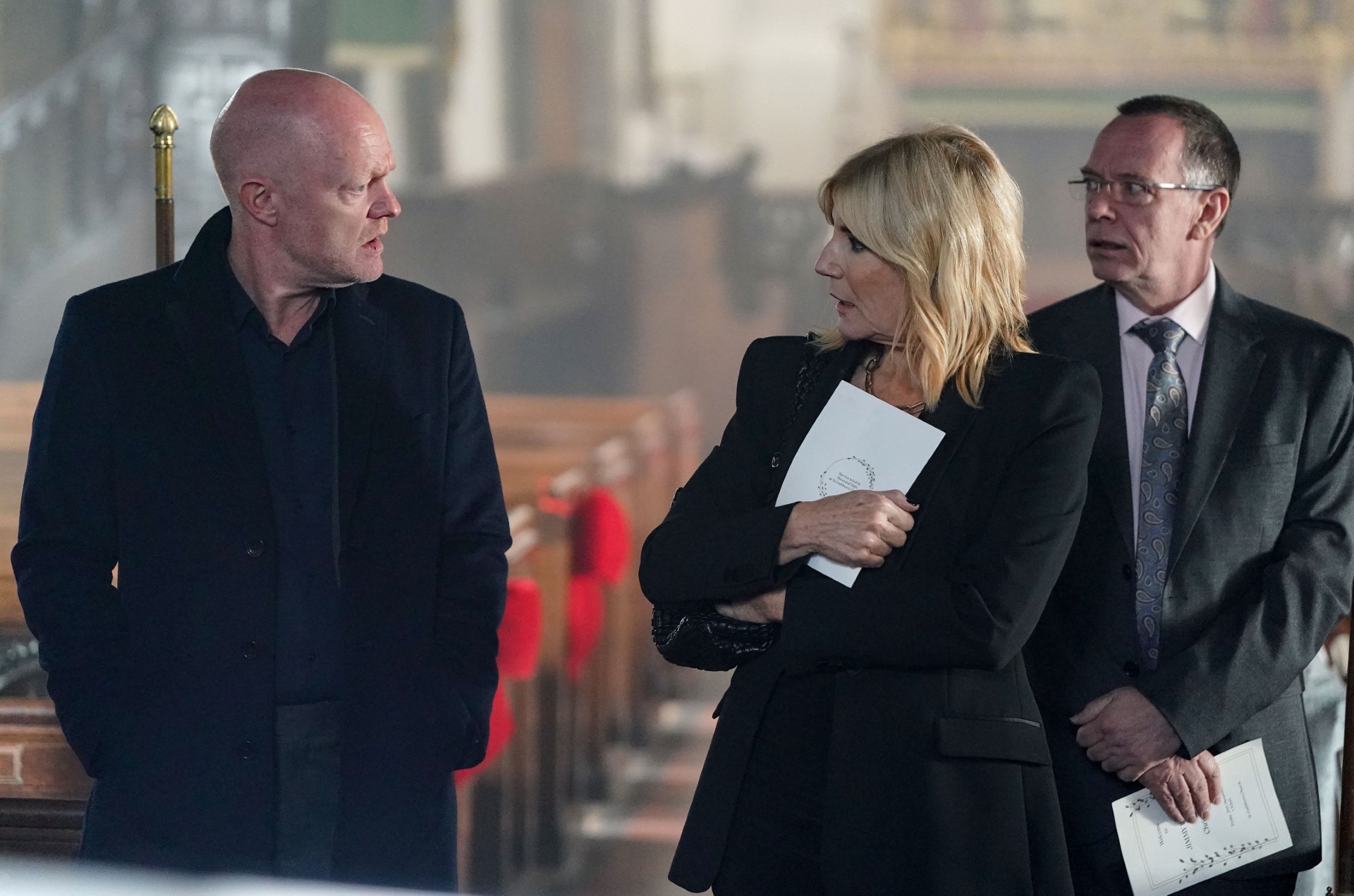 Max talks to a shocked-looking Cindy in the church on EastEnders