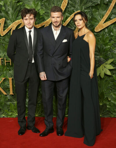 Brooklyn Beckham with Victoria and David