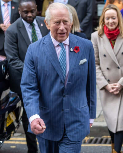 King Charles walking in blue suit