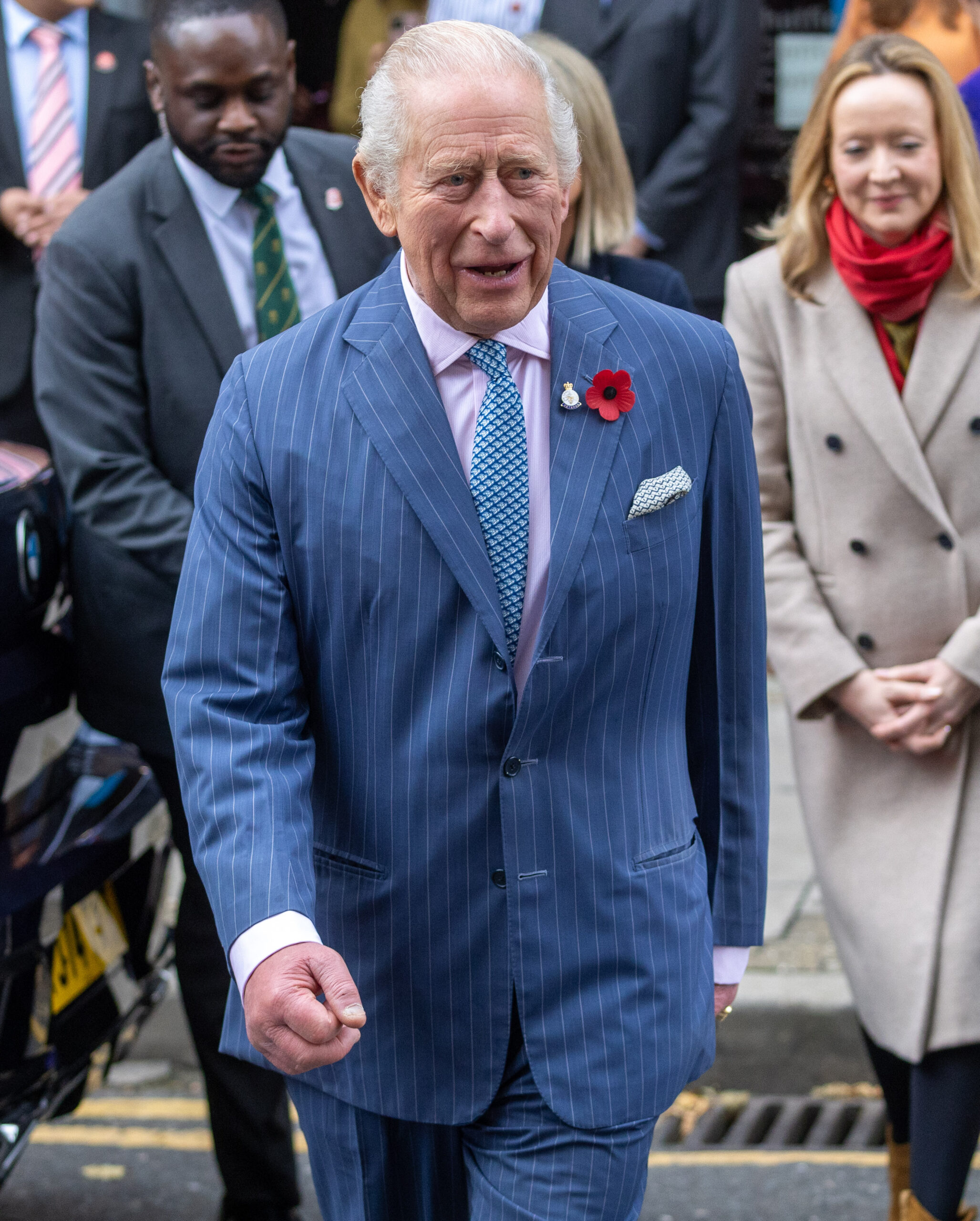 King Charles walking in blue suit