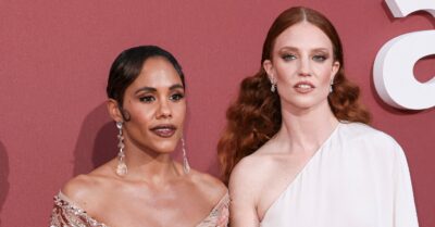 Alex Scott and Jess Glynne posing on the red carpet