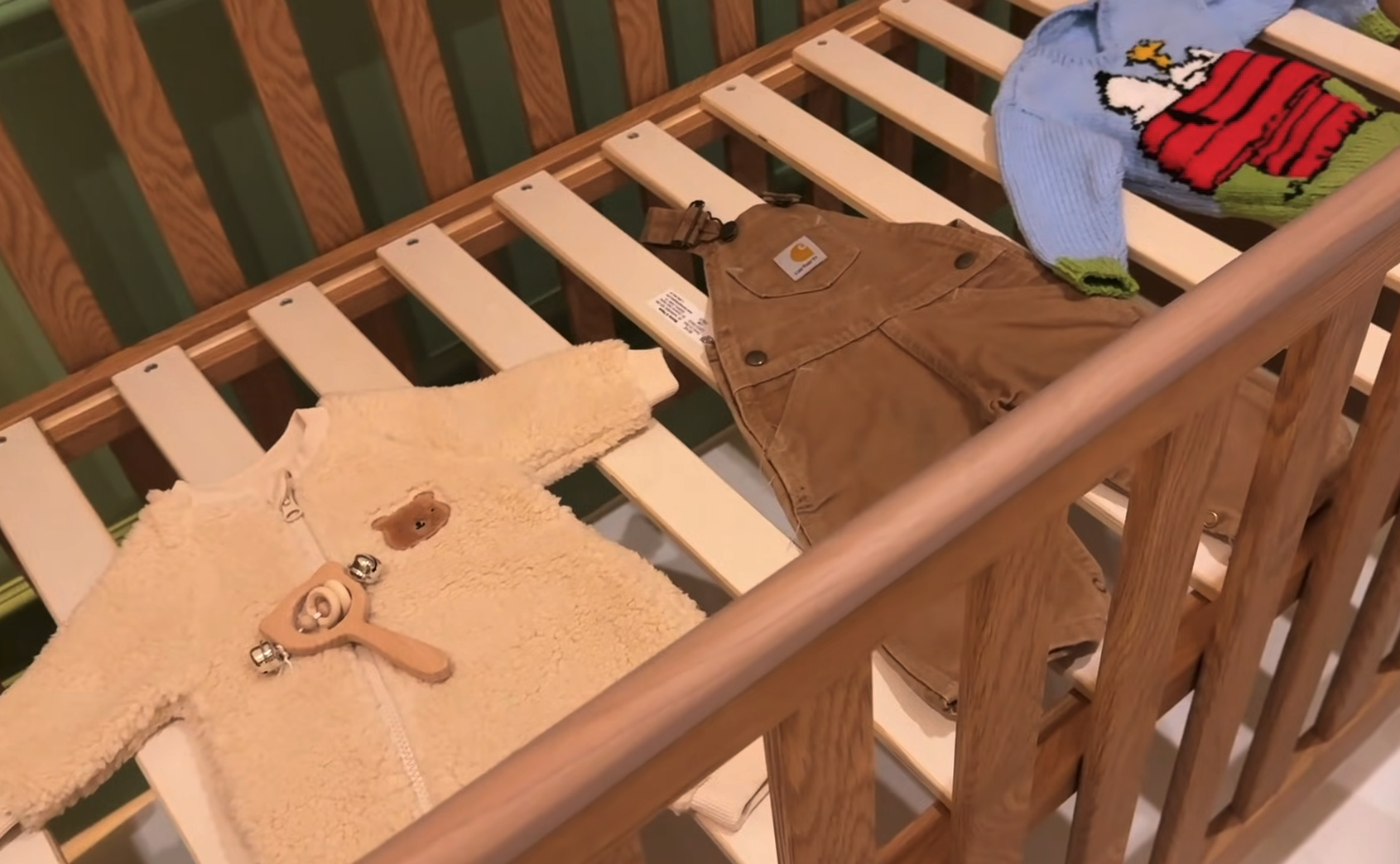 Baby clothes in a cot