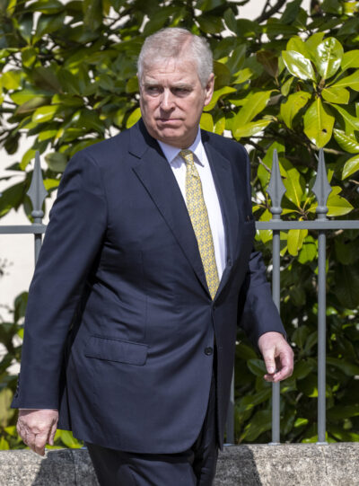 Andrew Mountbatten-Windsor walking in suit