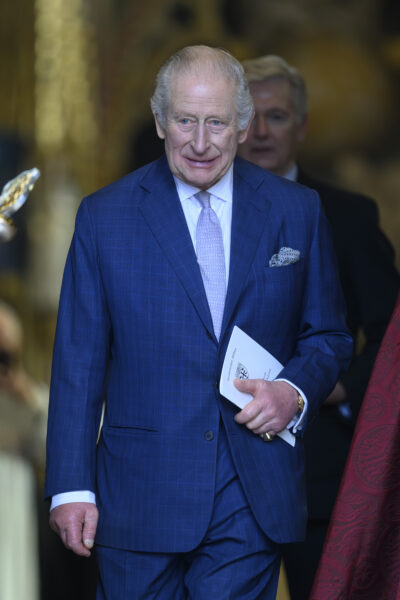 King Charles walking in blue suit