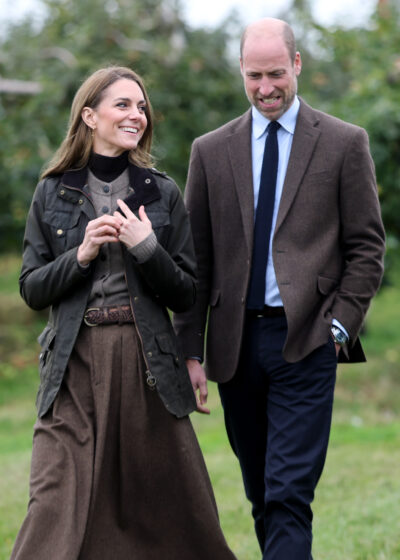 Prince William and Kate Middleton walking and smiling