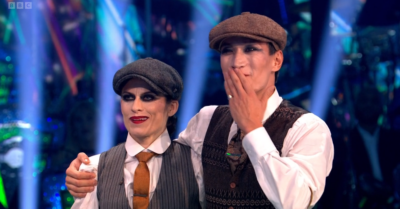 Karen Carney and Carlos Gu wearing Peaky Blinders hats on Strictly