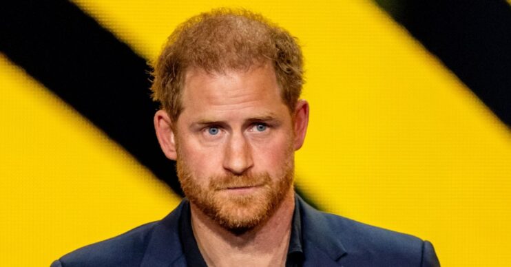 Prince Harry looks serious at event
