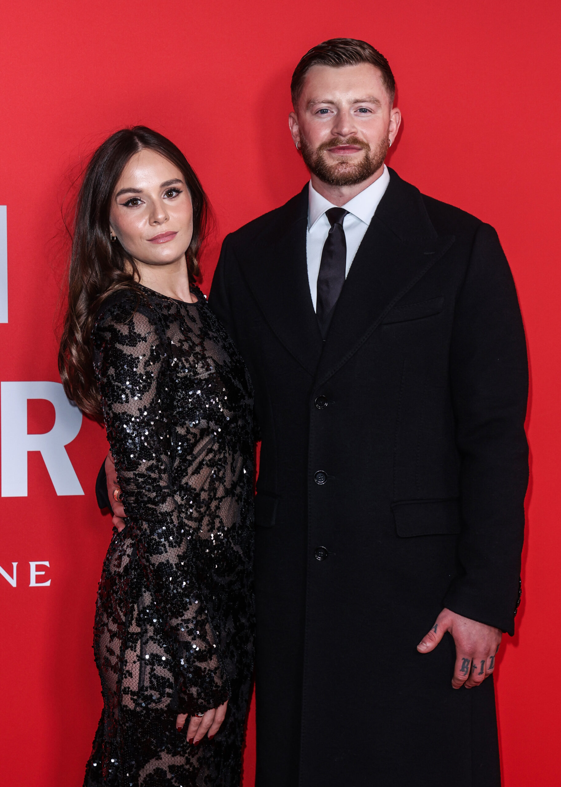 Holly Ramsay and Adam Peaty at an event