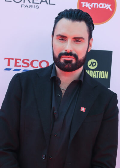 Rylan Clark in a black suit