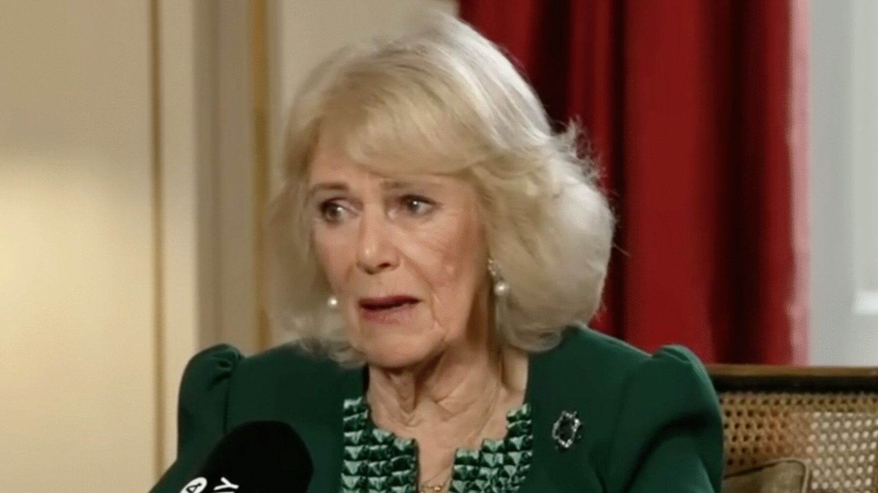 Queen Camilla with an emotional expression