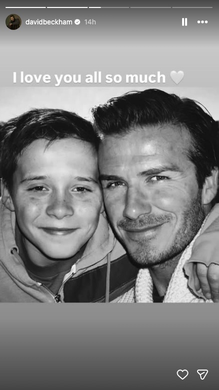 A black and white picture of Brooklyn and David Beckham