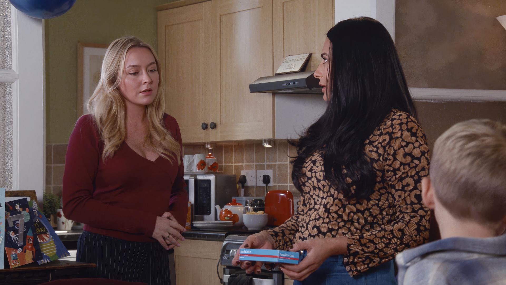 Megan and Alya with pregnancy test in Coronation Street