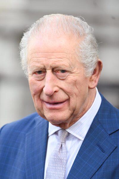 King Charles in blue suit during service