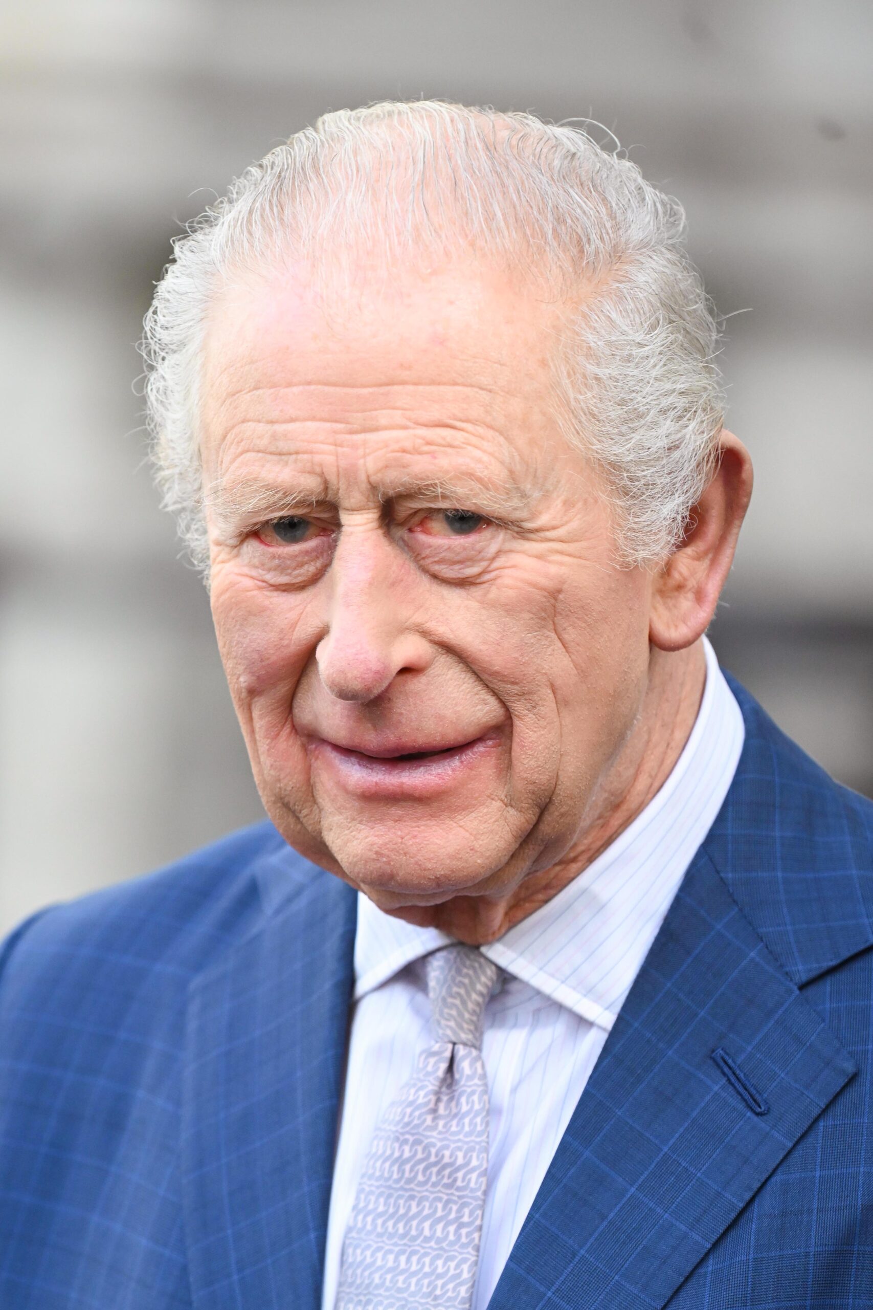 King Charles in blue suit during service