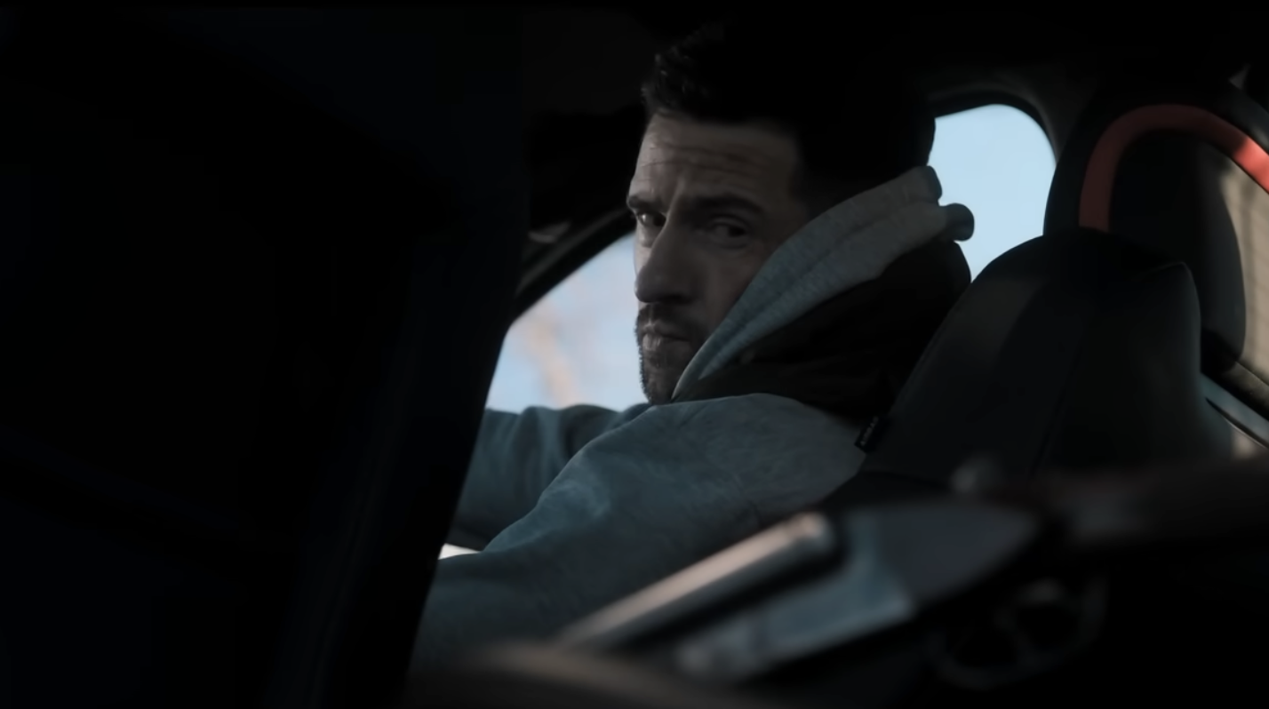 Ross looking at a gun 