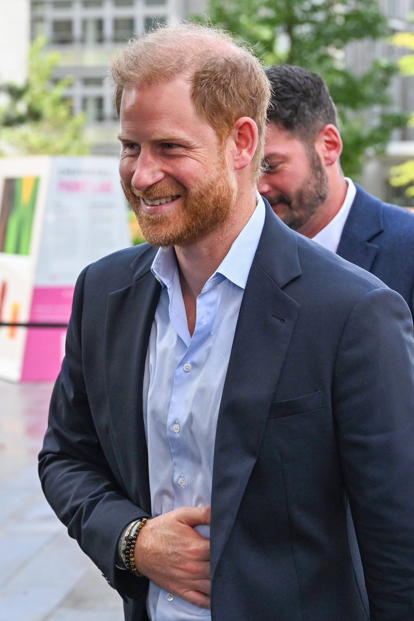 Prince Harry in navy blazer during UK visit