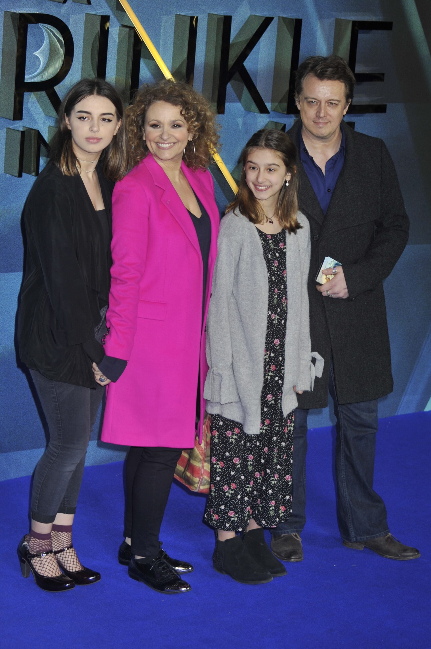 Nadia Sawalha and husband Mark with their kids 