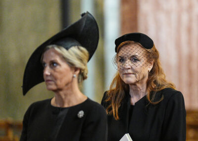 Sarah Ferguson frowning behind Duchess Sophie at the Duchess of Kent's funeral