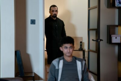 Ravi watches his family in EastEnders